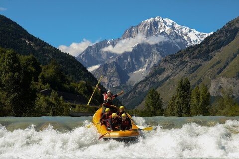 Totem Advenuture Experience the thrill of group rafting in the Aosta Valley, where adventure awaits against a backdrop of majestic mountains and clear blue skies. Rafting Kayaking Paragliding Canyoning Aosta Valley